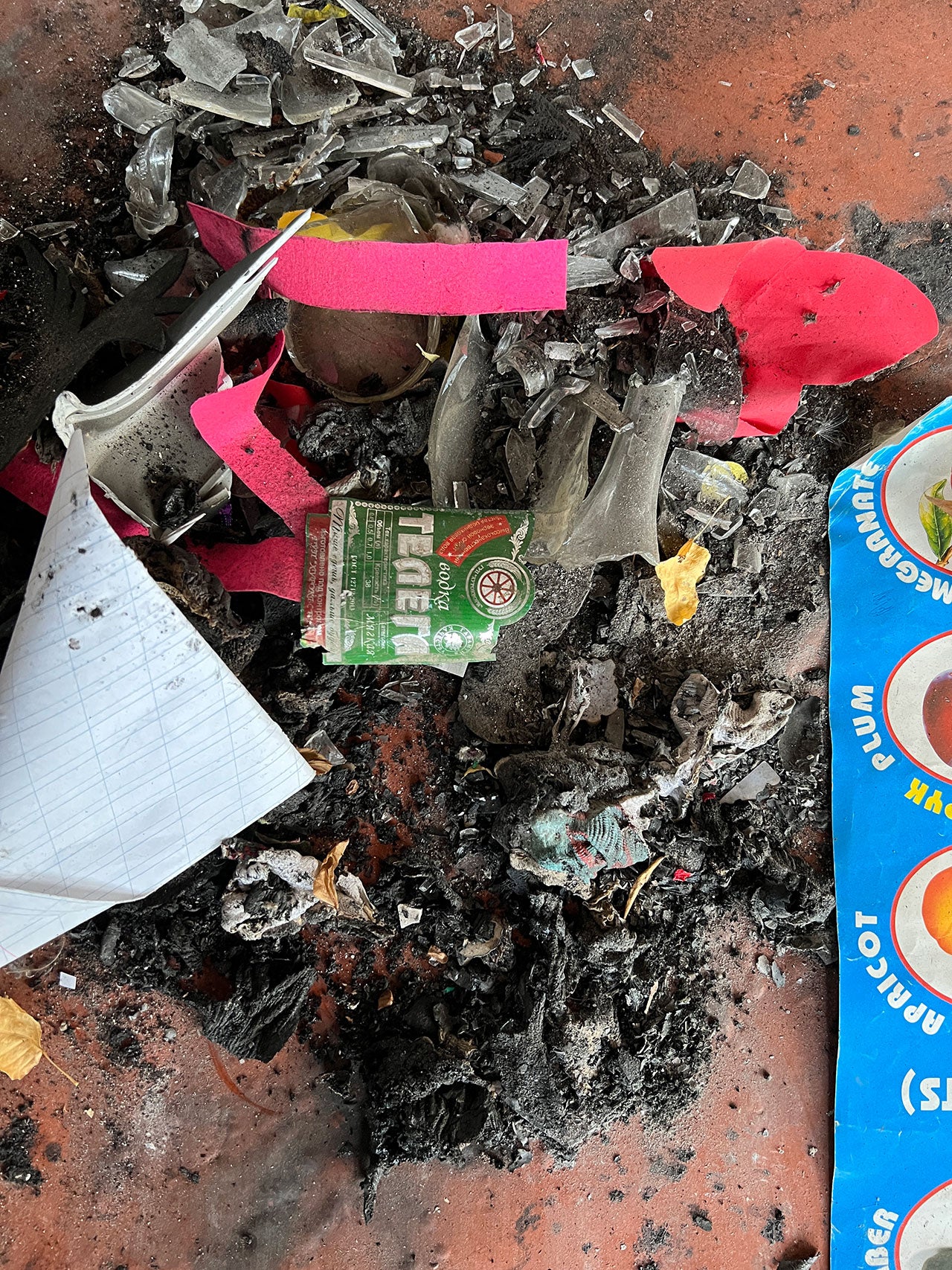 The remnants of a vodka bottle made in Tajikistan, apparently used as a Molotov cocktail, inside a burnt-out school in the Kyrgyz village of Ak-Sai.