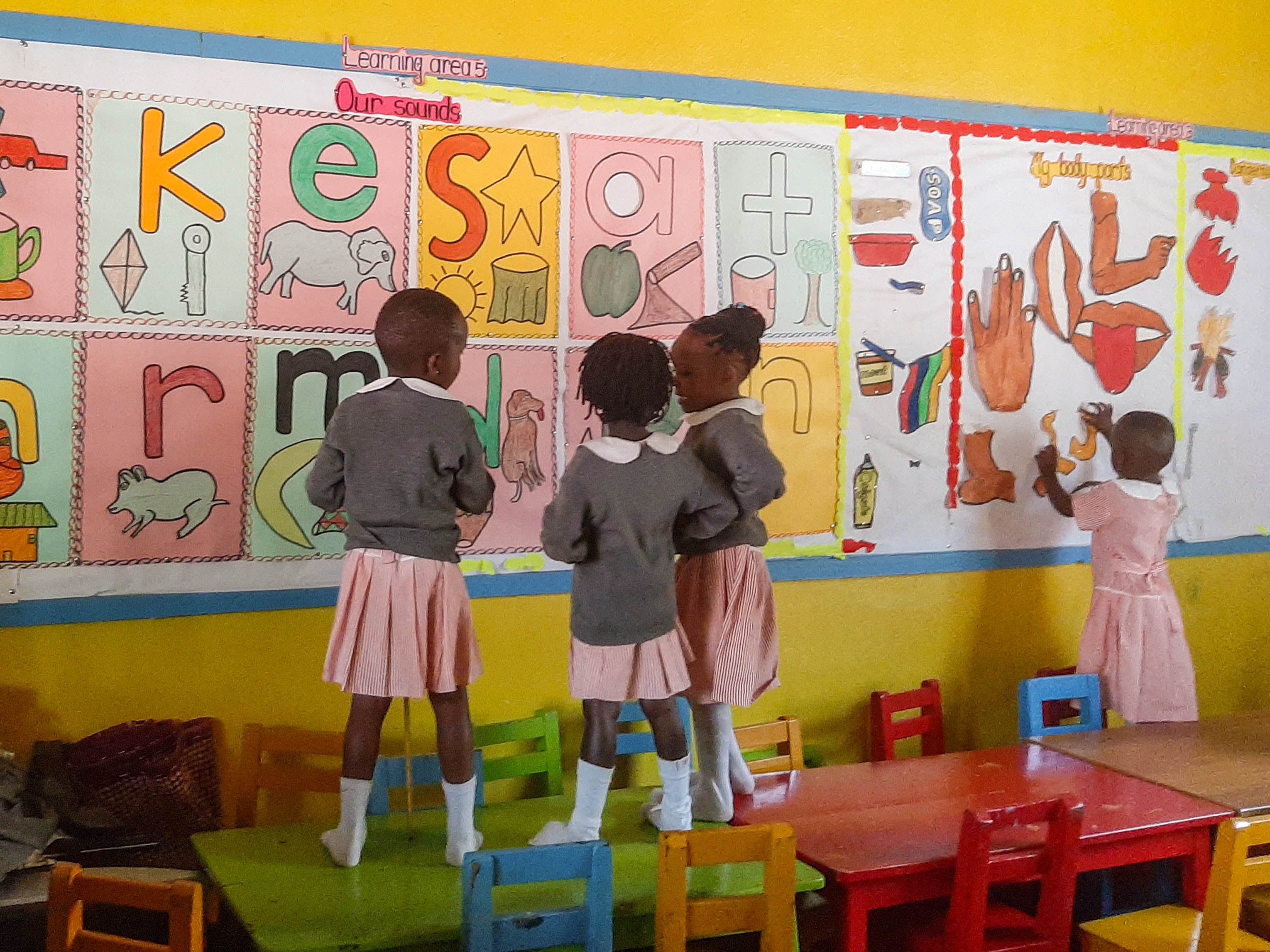 4 girls in a school classroom 
