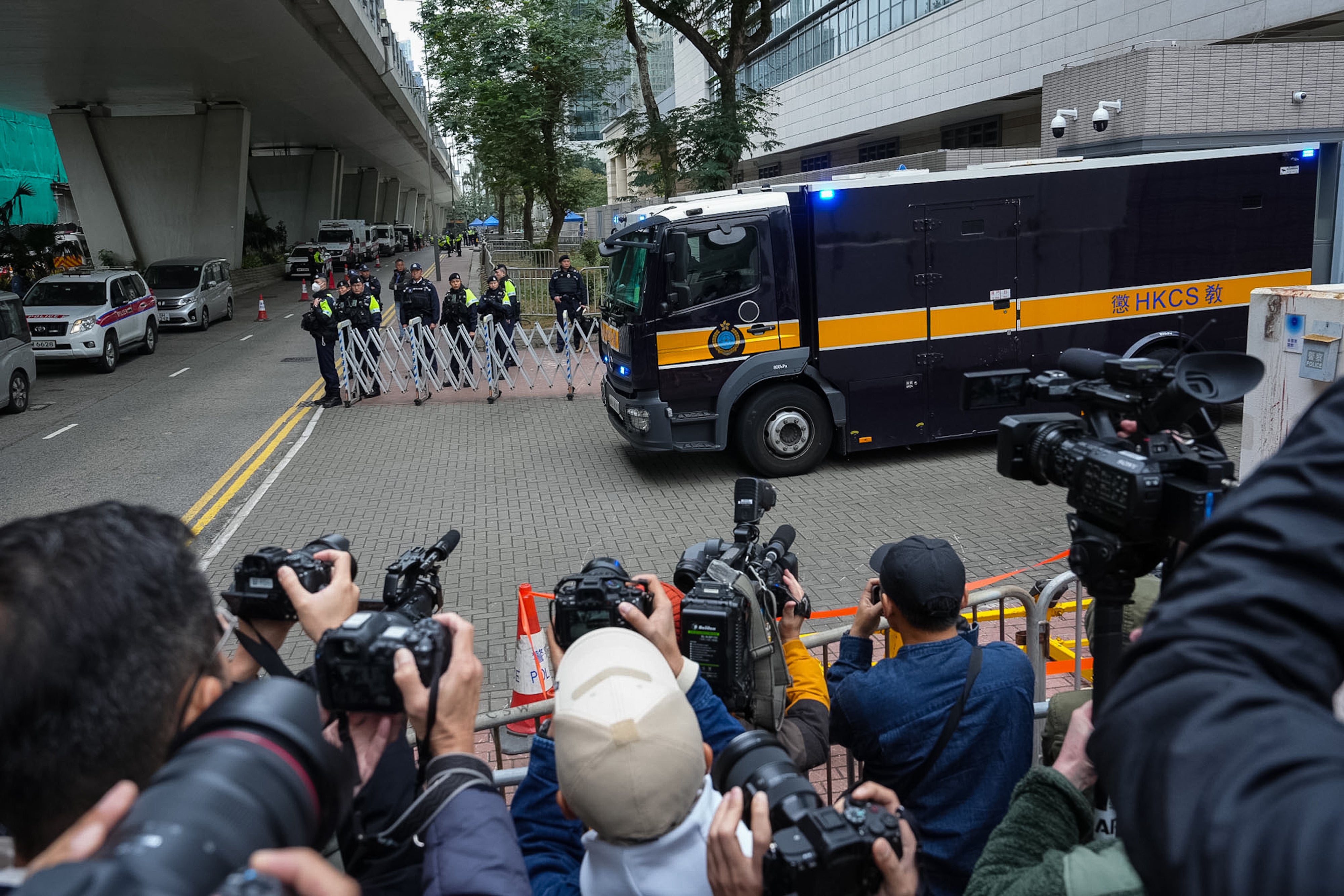 A correctional services department vehicle believed to be carrying Hong Kong publisher and activist Jimmy Lai leaves the West Kowloon Magistrates' Courts following Lai's sentencing, Hong Kong, February 9, 2026. 