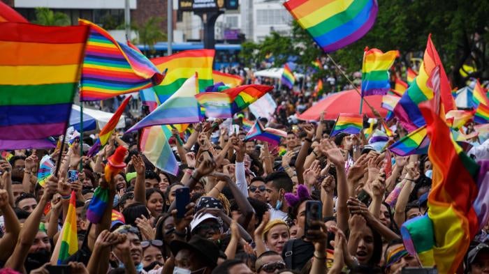 Flags of the LGTBIQ community raise and wave as people gather to protest and celebrate the International Pride Day celebrations in Cali, Colombia, July 4, 2021. 