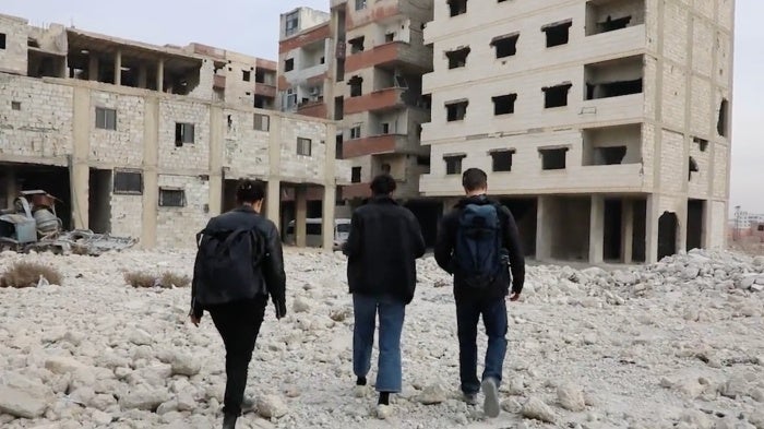 People walk near Damascus grave