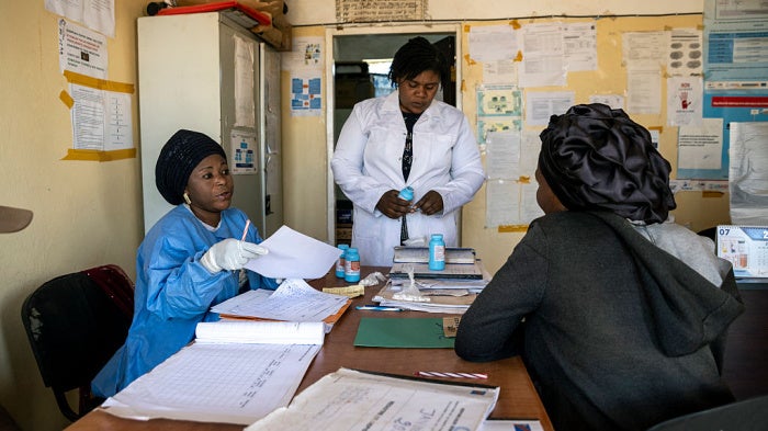 A patient receives a reduced supply of medication for HIV treatment, following the cut of USAID funds for treatment programs in Democratic Republic of Congo, July 31, 2025.