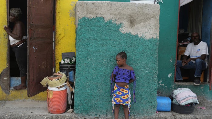 People look out at a street in the Simon-Pele neighborhood of Port-au-Prince, Haiti, September 22, 2025.