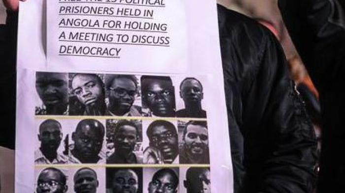 Protesters in London, stand at Piccadilly Circus calling for the release of 15 political prisoners in Angola, October 17, 2015. 