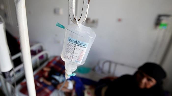 Woman holding child in a hospital in Yemen