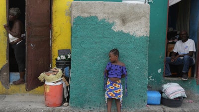 People look out at a street in the Simon-Pele neighborhood of Port-au-Prince, Haiti, September 22, 2025.