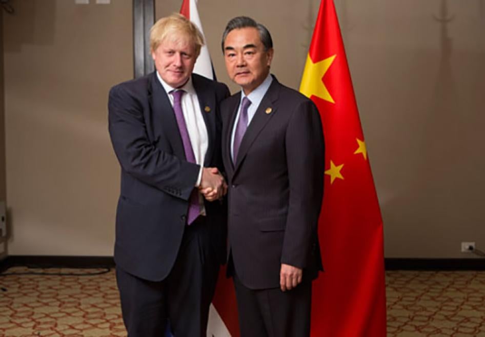 Then-United Kingdom Foreign Secretary Boris Johnson (L) meets with Chinese Foreign Minister Wang Yi at the G20 Foreign Ministers meeting in Buenos Aires, May 2018.