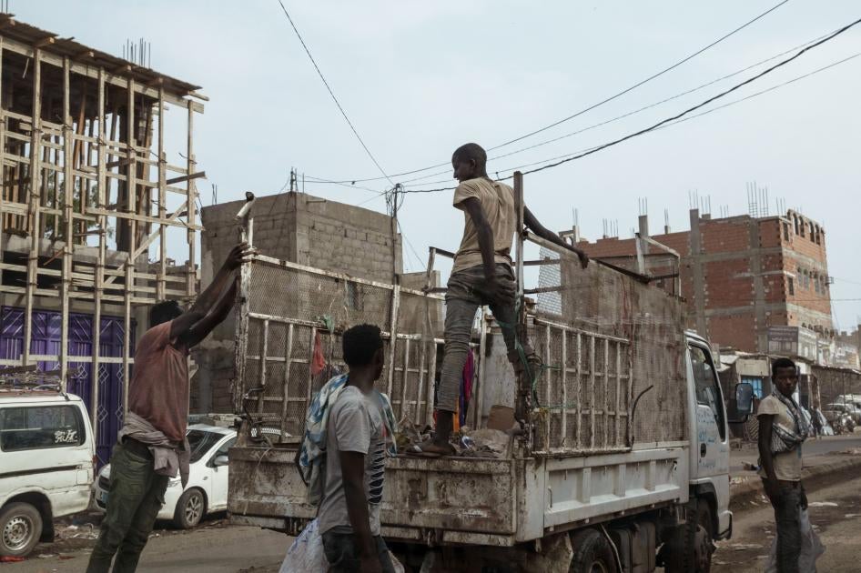 Ethiopian migrants climb on a pickup truck in Dhale province in Yemen.