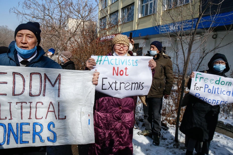 Protesters hold placards during an opposition rally