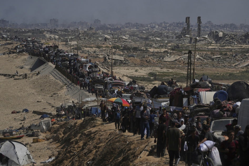 Displaced Palestinians flee northern Gaza along the coastal road toward the south, after Israel's military escalated its assault on Gaza City and warned residents to leave, September 16, 2025.