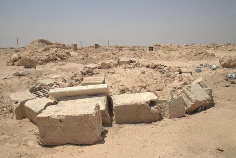 Site where local residents said they buried dozens of people killed in a March 20 attack on a school in Mansourah that housed displaced civilians. 