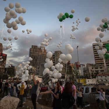 Lebanese people release balloons bearing the names of the victims of the 4 August Beirut seaport blast to mark the two-month anniversary of the explosion that killed 200 people and injured more than 6,500 others.
