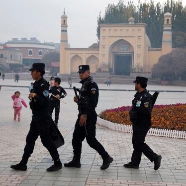 Chinese security personnel patrol near the Id Kah Mosque in Kashgar in China's Xinjiang region, November 4, 2017.