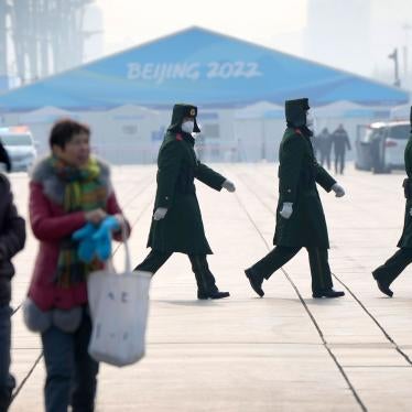 Chinese paramilitary police walk on the Olympic Green at the 2022 Winter Olympics in Beijing