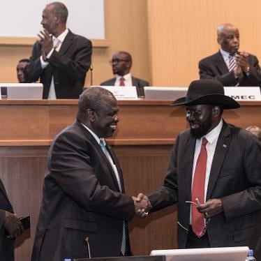 South Sudan's President Salva Kiir (2nd R) and his former deputy turned rebel leader Riek Machar (2nd L) shake hands as they make a last peace deal at the 33rd Extraordinary Summit of Intergovernmental Authority on Development (IGAD) in Addis Ababa on September 12, 2018.