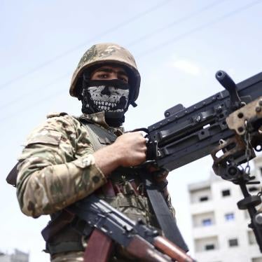 A fighter of the Turkish-backed Syrian National Army take part in a military parade in the countryside of Aleppo Governorate on June 9, 2022, as part of the forces' preparations for military actions on the areas controlled by the Syrian Democratic Forces.