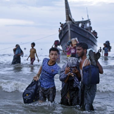 Rohingya asylum seekers disembark from their boat upon landing in Ulee Madon, North Aceh, Indonesia, November 16, 2023.