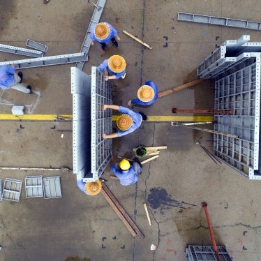 Workers make aluminum alloy products on a production line in Jinhu county, Jiangsu province, China, July 19, 2020.