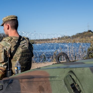 National Guard soldier stands guard on the banks of the Rio Grande river at Shelby Park in Eagle Pass, Texas on January 12, 2024.