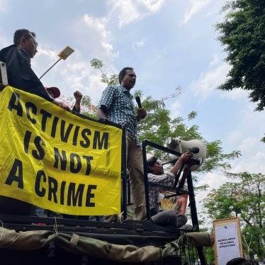 Haris Azhar after his trial at the East Jakarta court, delivering a speech from a truck outside the court house, January 8, 2024. 
