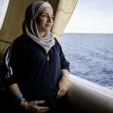 A Syrian woman, seven-month's pregnant, looks out at the Mediterranean Sea from the stern of the Geo Barents, September 20, 2024. 