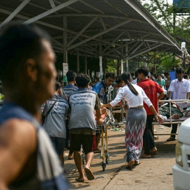 Medical workers transport an earthquake casualty at a hospital