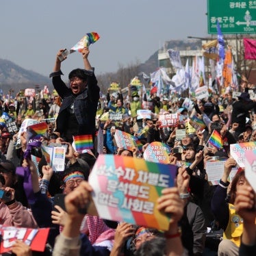 People celebrate after the Constitutional Court's ruling to remove President Yoon from office, near Anguk Station, Seoul, South Korea, on April 4, 2025. 