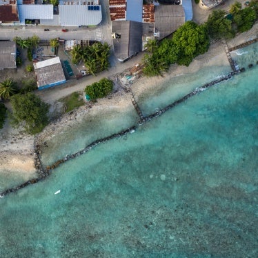 Concrete blocks are placed along the shoreline to try and prevent further coastal erosion in Mahibadhoo, Maldives, December 17, 2019.