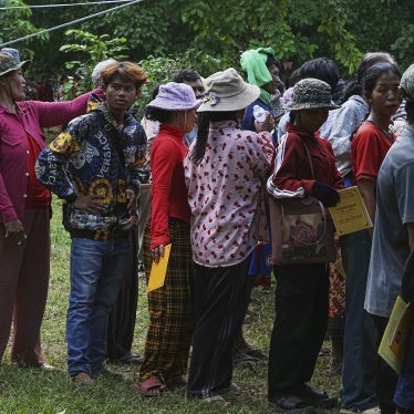 Cambodians who fled Thai-Cambodian border clashes line up to receive assistance in Oddar Meanchey province, Cambodia, July 25, 2025. 