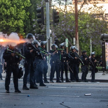 Los Angeles Police Department officers shoot kinetic impact projectiles at protesters outside City Hall  in Los Angeles, California, on June 8, 2025. © 2025 Apu Gomes/Getty Images