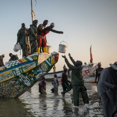 Fisherfolk working on a boat