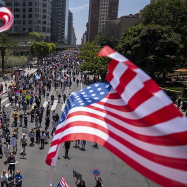 Demonstrators march during the "No Kings" national demonstration against US President Donald Trump and Immigration and Customs Enforcement in Los Angeles, California, June 14, 2025. 
