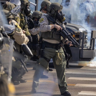 Sheriff deputies wield less-than-lethal munitions and tear gas during a "No Kings" protest in response to a series of federal immigration raids in Los Angeles, California, US, June 14, 2025. 