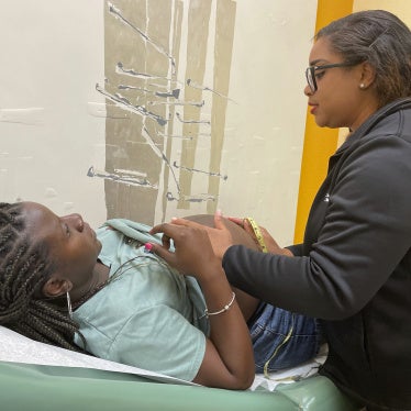 Midwife Celena Brown of Commonsense Childbirth in Florida, examines a patient during a pregnancy checkup in Winter Garden, Florida, US, June 25, 2024.