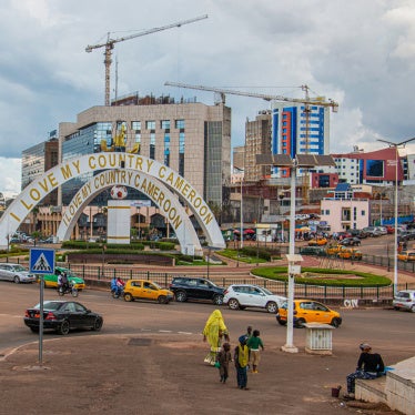Cars drive through an intersection near a monument in Yaoundé, Cameroon, September12, 2025. 