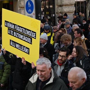 Participants hold a placard reading "The independence of the judges is your security - Stand by them!" as Hungarian judges and court employees demonstrate in Budapest, Hungary, on February 22, 2025, for independence of the judiciary, rule of law, and freedom of expression of judges.