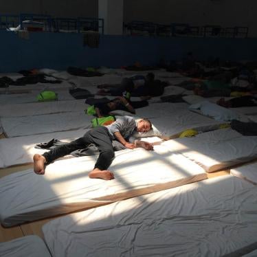 A young Egyptian man in the main room at the Pozzallo “hotspot” on June 9, 2016. The center was at double capacity and held 185 unaccompanied children. 