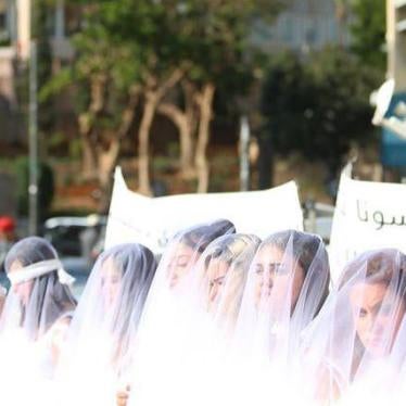 Demonstration outside Parliament on December 6, 2016, with women in white dresses and wrapped in bandages, calling for the repeal of article 522 of the penal code.