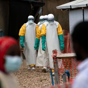 Health workers dressed in protective gear begin their shift at an Ebola treatment center in Beni, Democratic Republic of Congo, July 16, 2019.